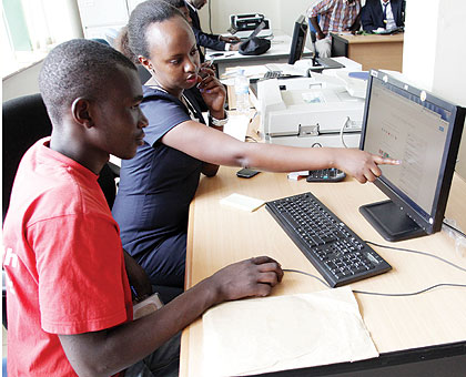 An official at RDB guides a client on how to register business online. Online registration is expected to further ease doing business in the country. John Mbanda.  