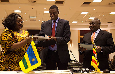 Defence ministers; Raychelle Omamo of Kenya, Rwandau2019s James Kabarebe and Crispus Kiyonga of Uganda after signing a defence pact in Kigali last month. File. 