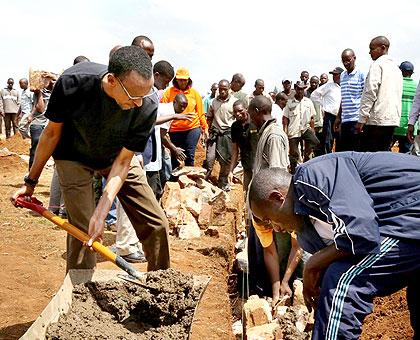 President Kagame helps build houses for the needy during the monthly Umuganda. Village Urugwiro