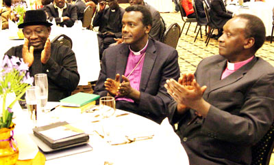 Bishop Louis Muvunyi of Kigali (C), with Bishop Birindabagabo (R) and Amb. Ogidi-Oke at the dinner. John Mbanda. 