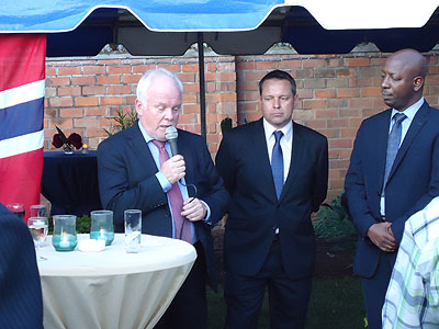 Gaustadsaether (L), Norwayu2019s ambassador to Rwanda, with Robert Woffenden (centre), the new consular during the re-opening of the consulate. (Peterson Tumwebaze)