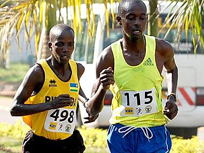 Godfrey Rutayisire, right, seen here competing in a past half marathon race, will lead Rwandau2019s quest for medals in  Kampala. (File)