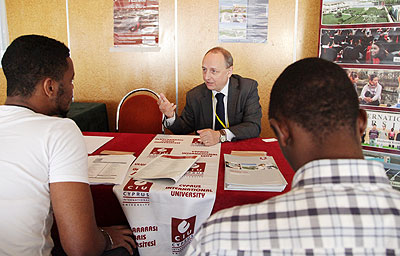 Patrick Douse, of Cyprus International University, talks to potential students at the Rwanda International Education fair in Kigali on Monday. John Mbanda.