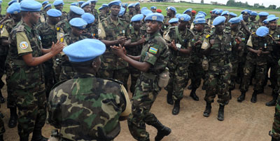 BRAVO RDF Soldiers in a morale-boosting session on arrival from a peacekeeping mission in Darfur in 2012.  The countryu2019s peacekeepers have been lauded for helping to pacify the v....