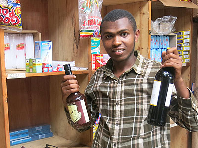 Nsengiyumva displays some of the wares in his grocery. (Moses Opobo)