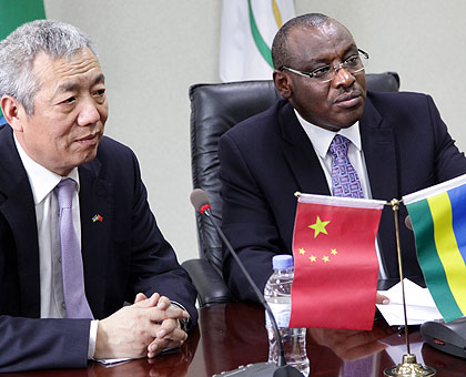 Minister Claver Gatete with Chinese Ambassador to Rwanda, Shen Yongxiang after signing the agreement yesterday. (John Mbanda)