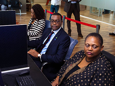 Adesina (C) and Jendayi Frazer, the EAX board chair (R) at EAX in kigali on Wednesday. (Timothy Kisambira)