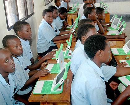 School children use laptops in one of the schools . (File)