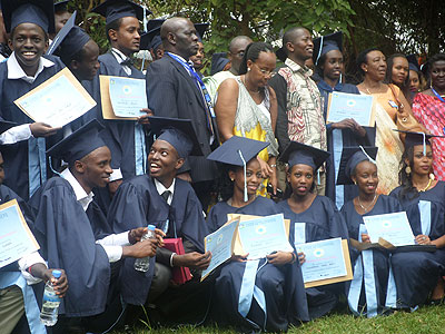 Senior Six leavers pose for a group photo at La Colombiere School after the function. (Samson Kasasira)