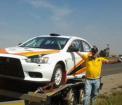 Rwanda's national champion Davite Giancarlo poses with his Mistubishi Evo X, which he will use in pursuit for the Sasol title. Courtesy