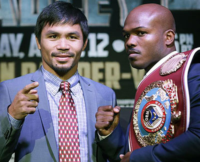 Manny Pacquiao, of the Phillipines, left, poses for a photo with current WBO World Welterweight champion Timothy Bradley. Net Photo