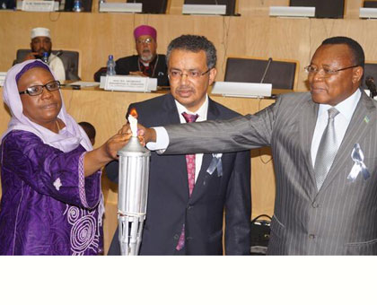 Dr Ghebreyesus (C), Dr Aisha Abdullahi, the AU Commissioner for Political Affairs (L), and Prof. Joseph Nsengimana, the Ambassador of Rwanda to Ethiopia, lit the Flame of Remembran....