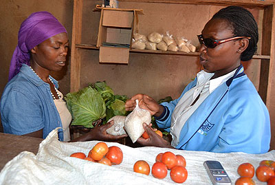 Dunia serves a buyer. She was rejected by her husband after she became visually impaired in 2001.   Jean du2019Amour Mbonyinshuti