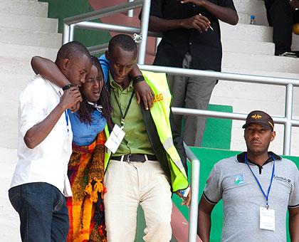 Emergency workers attend to a trauma victim during the 20th commemoration at Amahoro Stadium. (Timothy Kisambira)