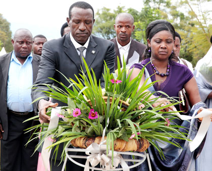 Ntawukuliryayo (right) lays a wreath at Rebero memorial site yesterday