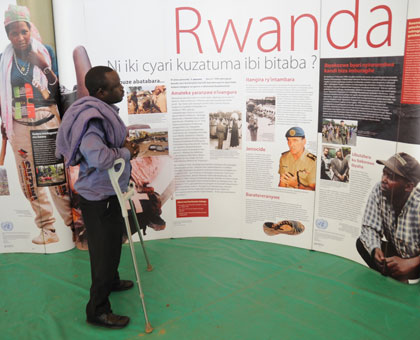 A man looks at pictures at Kigali Genocide Memorial Centre. File. 