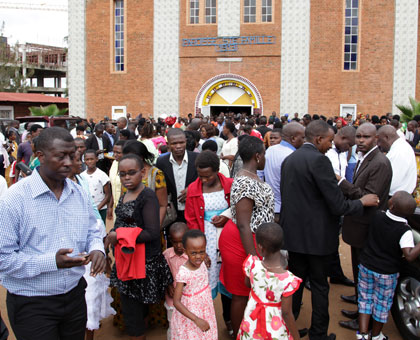 Christians leave St Famille in Kigali after Easter Prayers yesterday. Religious in Kigali preached unity and reconciliation among Rwandans.  John Mbanda.