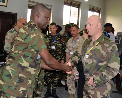 Brig. Gen. Charles Karamba welcomes Lt. Col. Richard Zabot, who heads the visiting team of facilitators. Jean du2019Amour Mbonyinshuti. 