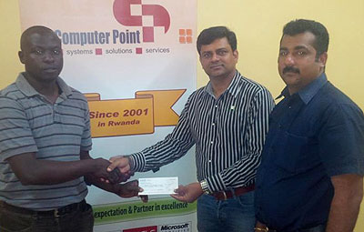 RCA General Manager Joshua Mwanja, left, receives the cheque from Computer Point General Manager Dinesh Vachakkara, right. Courtesy