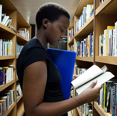 A young lady reads a book at Kigali Public Library. File.