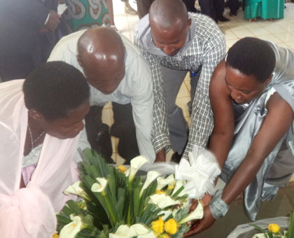 A wreath is laid in honour of Genocide victims buried at Mibilizi. JP Bucyensenge.