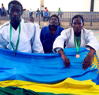 Yannick Uwase and Zuena Mukamana  display their bronze medals won at the regional tournament.