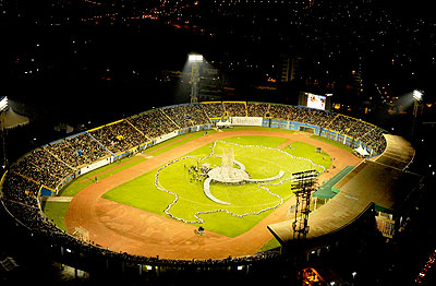 Children form a map of Rwanda during a play at the Amahoro National Stadium during the 20th commemoration of the 1994 Genocide against the Tutsi on April 7. File