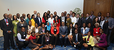 President Kagame poses for a group photo with the community of Global Shapers drawn from across Africa at the  World Economic Forum in Abuja, Nigeria yesterday. Village Urugwiro. 