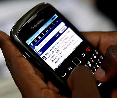 A mobile user surfs on a phone.Timothy Kisambira. 