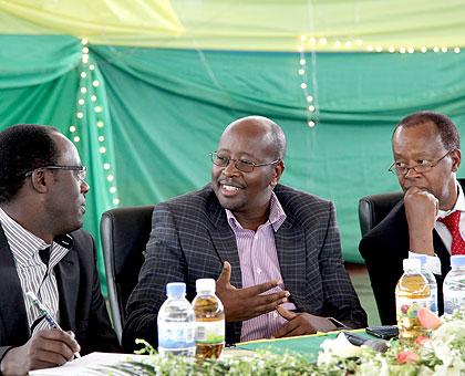 Local Government Minister James Musoni (C), Kigali City Mayor Fidu00e8le Ndayisaba (L) and Chairman of Kigali City Council Dr Dieudonnu00e9 Sebashongore at a meeting with civic and district leaders at Petit Stade yesterday. (John Mbanda)