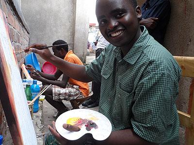 Niyonsaba developing a sketch at his place of work. (Moses Opobo)