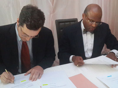 Christopher Kneiding AB Bank Rwanda CEO and IFCu2019s Jean-Philippe Prosper sign the funding deal on Tuesday. (Ben Gasore)