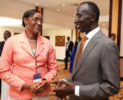 Chief Justice Prof. Sam Rugege (R) chats with KIAC Secretary General Bernadette Uwicyeza, at the conference yesterday. Timothy Kisambira.