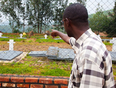 A Genocide survivor points to the spot where his family members were buried in Ngororero District.  File.