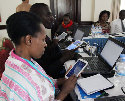 Teachers train in using tablet computers in February. John Mbanda.