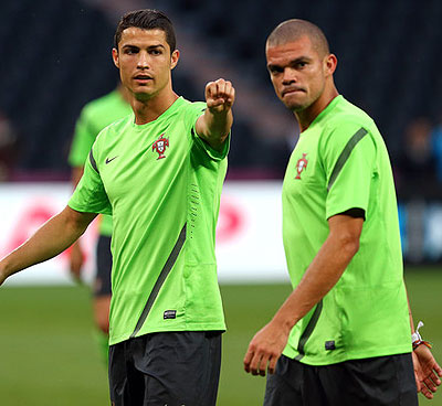 Cristiano Ronaldo looks on during a Portugal training session alongside teammate Pepe, right. Net Photo