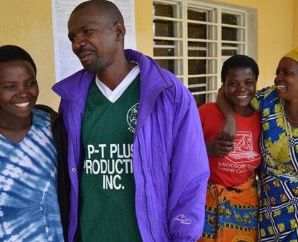 Minani, a genocide perpetrator (second left), chats with survivors. (Jean du2019Amour Mbonyinshuti)