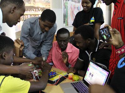 Students use a portable lab to develop IT solutions . (Patrick Buchana)