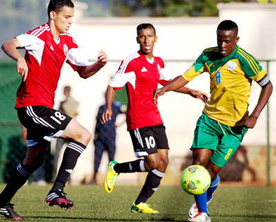 Haruna Niyonzina, right, enjoyed a good game against Libya but admits things are going to be tougher in the next round against Congo.  Timothy Kisambira