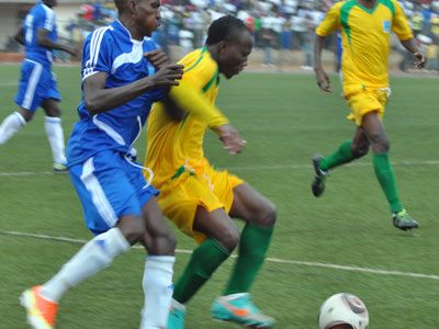 Rayon Sports right-back Karim Ndagijimana battles with AS Kigali's left-back Ngirinshuti Mwemere during a past meeting between the two rivals. (File)