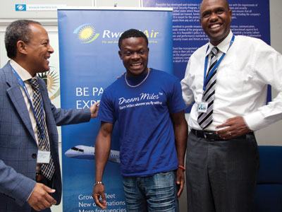 Adebowale (centre) shares a light moment with RwandAir boss John Mirenge (right) and Mikael Gobena, General Manager, Commercial. (Timothy Kisambira)