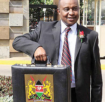 Kenyau2019s Treasury Cabinet Secretary Henry Rotich with the 2013/14 budget last year. The countryu2019s next financial year budget looks to strengthen security, among others. Rotich also announced initiatives to promote tourism and trade in the country. 