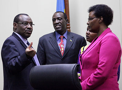 Finance minister Claver Gatete (L), talks to the president of the Senate, Jean Damascene Ntawukuliryayo (C), and Speaker Donatille Mukabalisa after the Budget presentation last week. John Mbanda. 