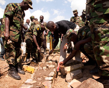 Defence minister James Kabarebe (in black shirt) launches the construction of a health centre in Gatoma Sector, Gicumbi District, yesterday. T. Kisambira.