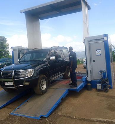 A police officer checks a vehicle during routine vehicle inspections. File