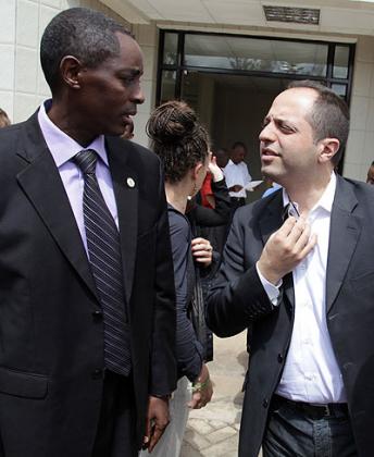 CNLG Executive Secretary Jan de Dieu Mucyo (L) with Benjamin Abtan, the president of (EGAM) after a meeting in Kigali on Monday. John Mbanda.