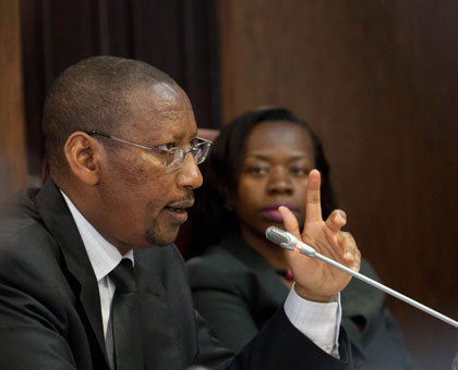 National Bank of Rwanda (BNR) governor John Rwangombwa (L), together with  deputy governor Monique Nsanzabaganwa during the media briefing in Kigali yesterday. Timothy Kisambira.