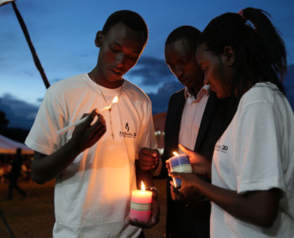 Children light candles at Nyanza Genocide Memorial Centre in Kicukiro during the 20th commemoration anniversary.Timothy Kisambira.mbira.