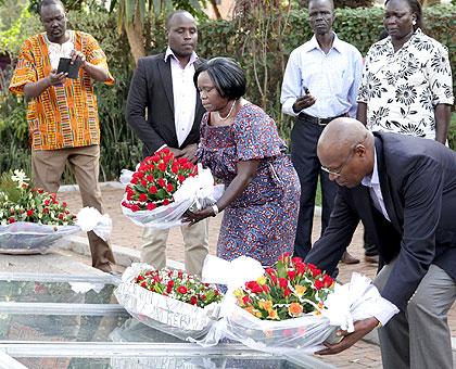 Anne Itto Leonardo and Joseph Karemera lay wreaths on a mass grave at Gisozi Genocide Memorial. (John Mbanda)