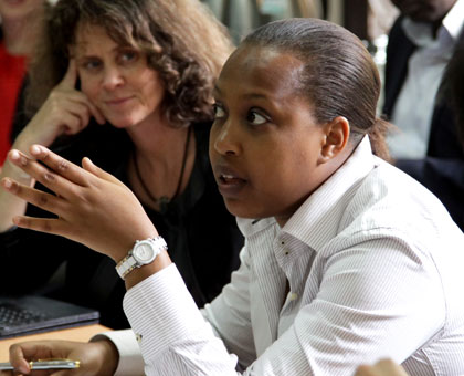 Sayinzoga (R) makes a point as World Bank country manager Carolyn Turk looks on at the launch of CPIA yesterday. John Mbanda.